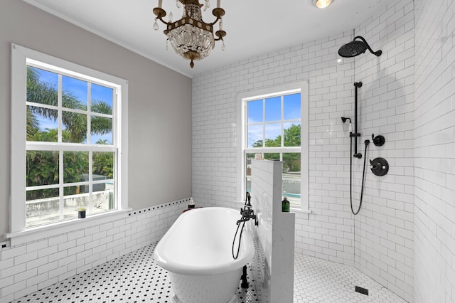 bathroom featuring crown molding, tile walls, separate shower and tub, and a notable chandelier