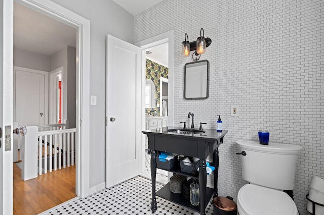 bathroom featuring toilet and sink