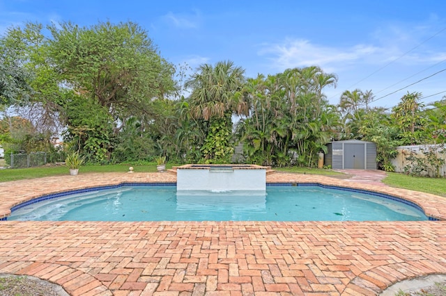 view of pool with a storage unit