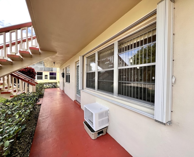 view of patio featuring a wall unit AC