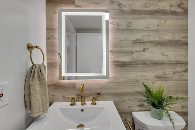 bathroom featuring sink and toilet