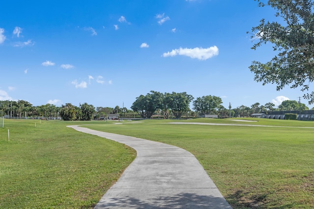 view of home's community featuring a lawn