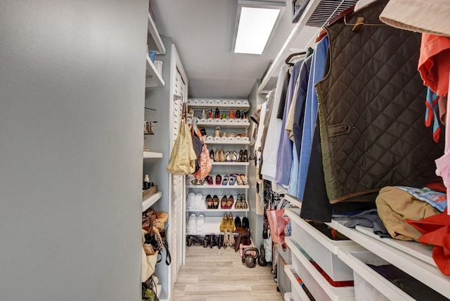 spacious closet featuring light wood-type flooring