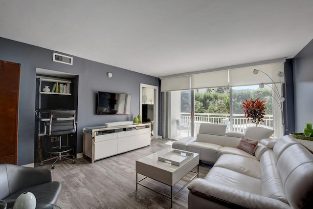 living room with light hardwood / wood-style floors