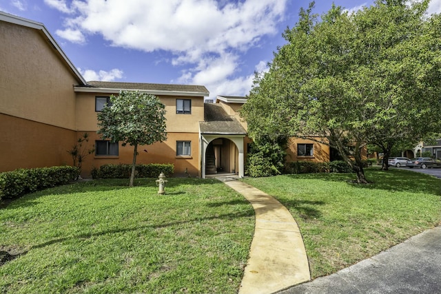 view of front of house with a front lawn