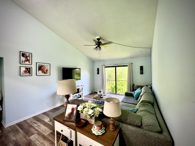 living room with hardwood / wood-style flooring, vaulted ceiling, and ceiling fan