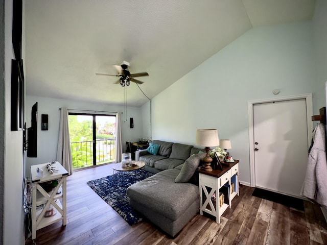 living room featuring wood-type flooring, lofted ceiling, and ceiling fan