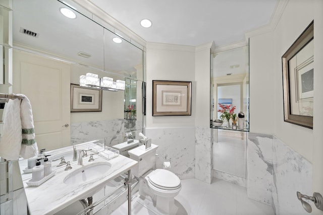 bathroom featuring sink, tile walls, tile patterned flooring, ornamental molding, and toilet