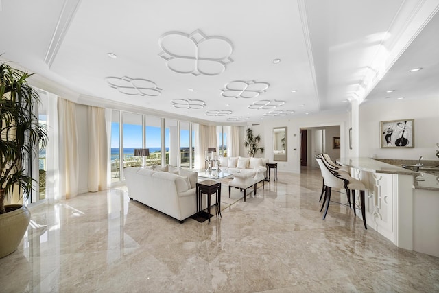 living room with a wall of windows and ornamental molding