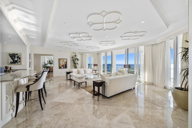 living room featuring crown molding and floor to ceiling windows