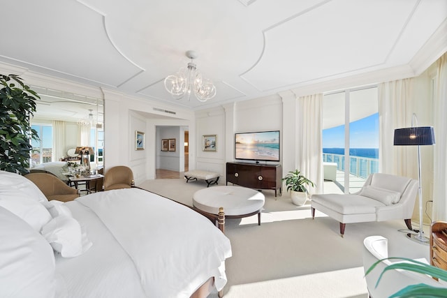 bedroom with ornamental molding, access to exterior, and a chandelier