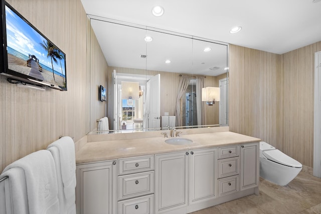 bathroom featuring vanity and toilet