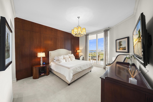 bedroom featuring crown molding, an inviting chandelier, light carpet, access to outside, and wood walls