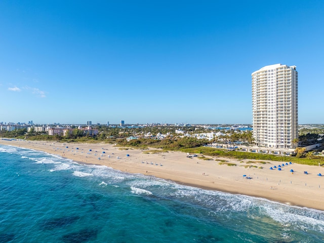 bird's eye view featuring a view of the beach and a water view