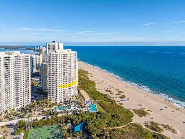 birds eye view of property featuring a view of the beach and a water view