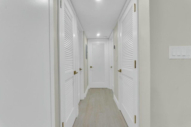 corridor with light wood-type flooring