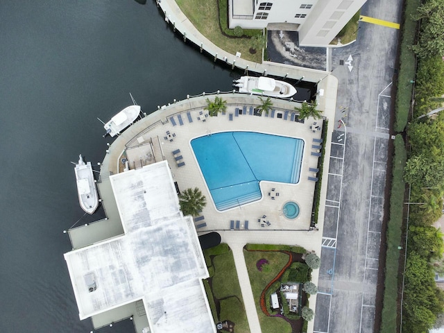 birds eye view of property with a water view