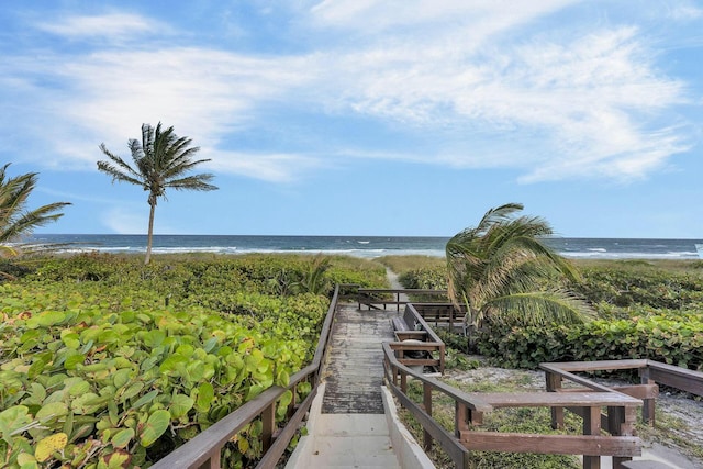 property view of water featuring a beach view