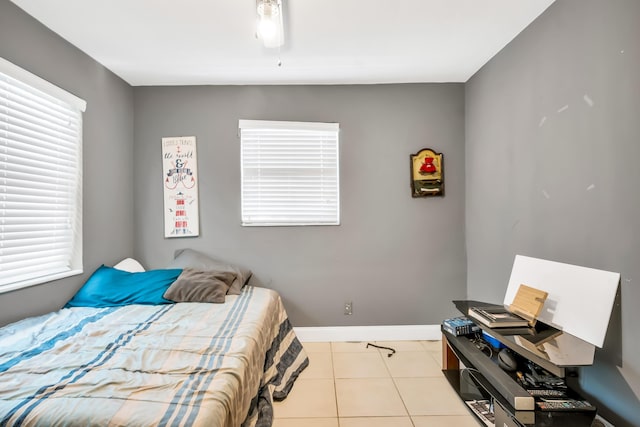 bedroom featuring light tile patterned floors