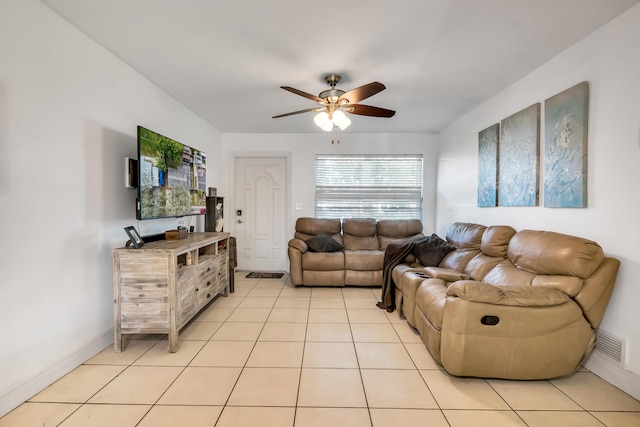 living room featuring ceiling fan and light tile patterned floors