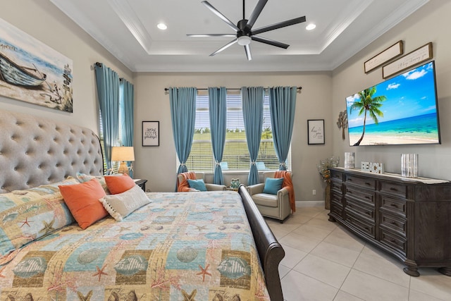 tiled bedroom with ornamental molding, a raised ceiling, and ceiling fan