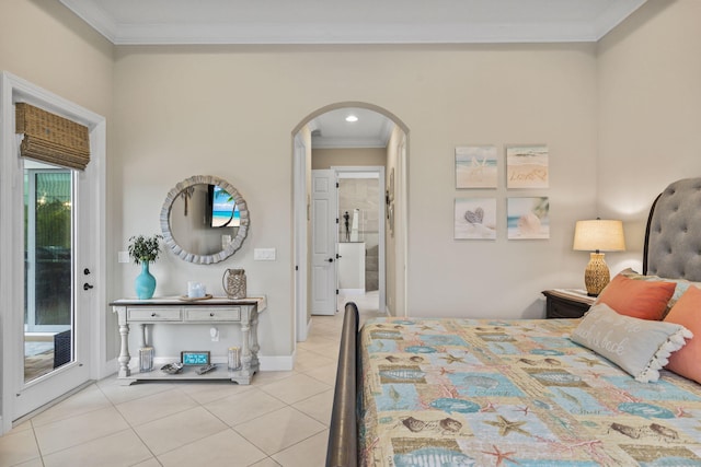 tiled bedroom with ornamental molding and access to outside