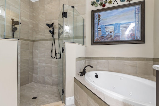 bathroom with separate shower and tub