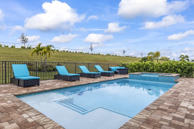 view of swimming pool featuring a patio area, a lawn, an in ground hot tub, an outdoor living space, and a rural view