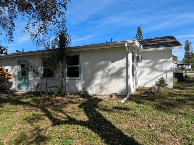 view of side of home featuring a lawn