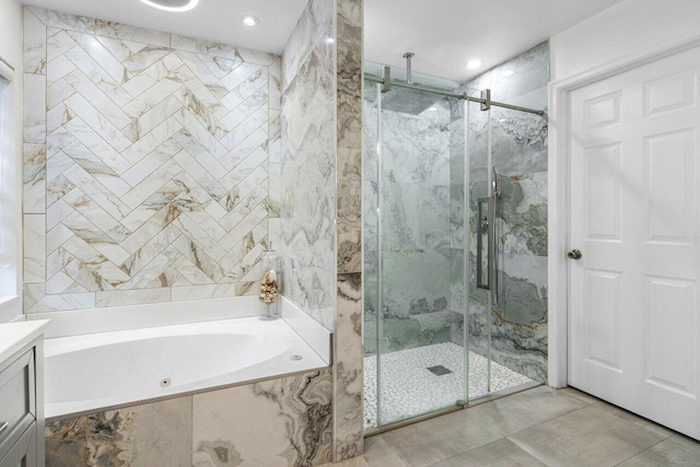 bathroom with shower with separate bathtub, tile patterned floors, and vanity