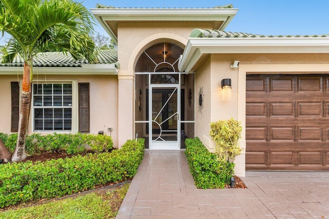 entrance to property featuring a garage