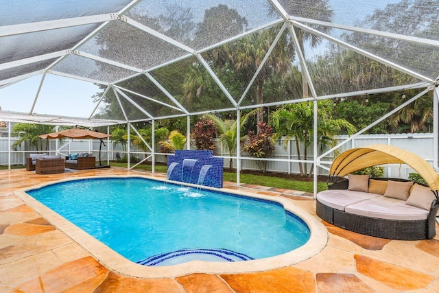 view of swimming pool with a patio area, glass enclosure, an outdoor living space, and pool water feature