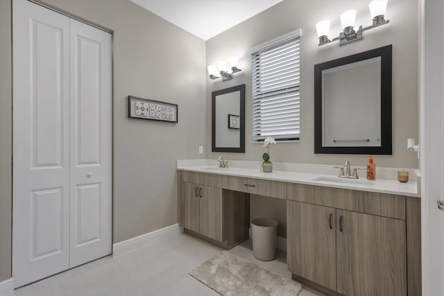 bathroom with vanity and tile patterned flooring