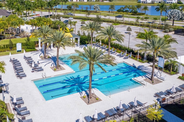 view of swimming pool with a patio area, a gazebo, and a water view