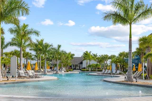 view of swimming pool featuring a patio and pool water feature