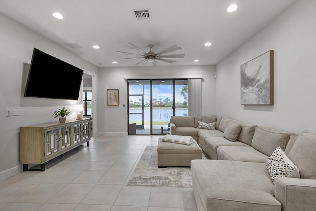 tiled living room featuring ceiling fan