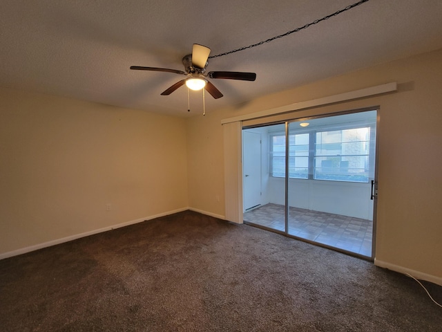 carpeted empty room with ceiling fan