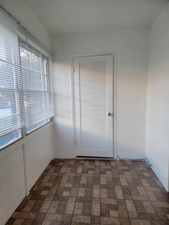 unfurnished sunroom featuring a wealth of natural light