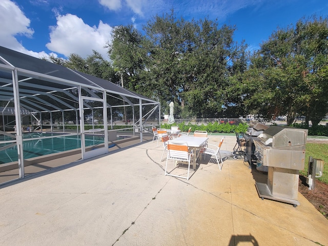 view of patio / terrace featuring glass enclosure