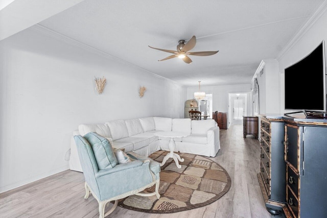 living room with ceiling fan, ornamental molding, and hardwood / wood-style flooring