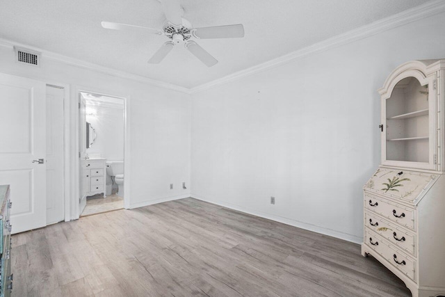 unfurnished bedroom with light wood-type flooring, ceiling fan, ornamental molding, and ensuite bath