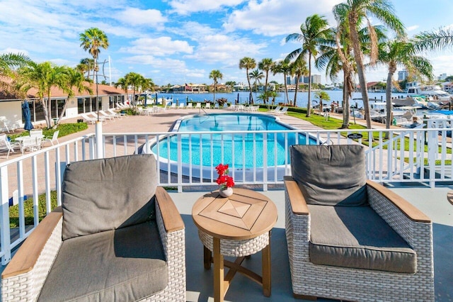 view of pool with a water view