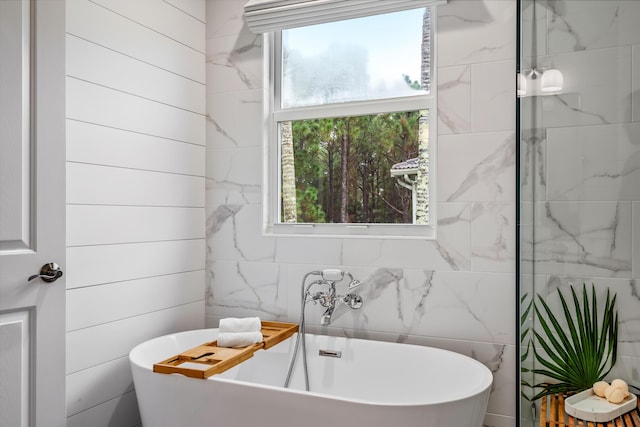 bathroom featuring a tub to relax in