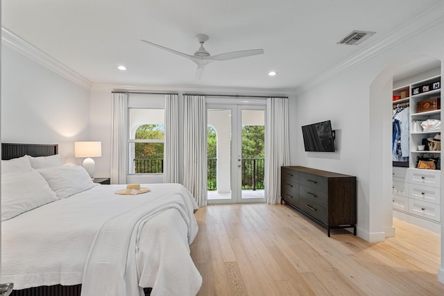 bedroom featuring crown molding, ceiling fan, access to exterior, and light hardwood / wood-style floors