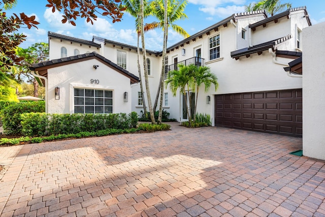 mediterranean / spanish-style home featuring a garage