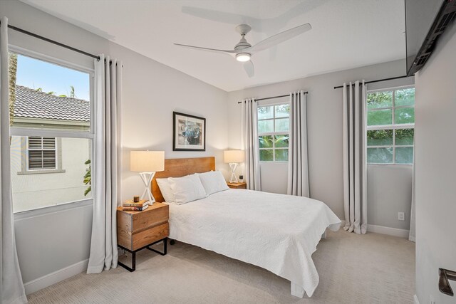 carpeted bedroom with ceiling fan