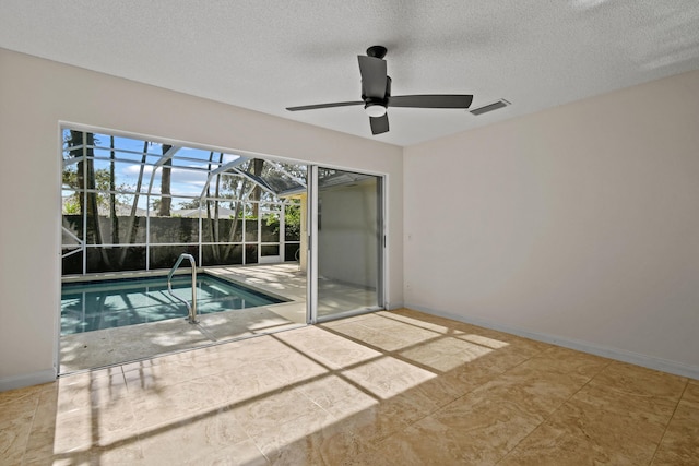 view of swimming pool featuring ceiling fan