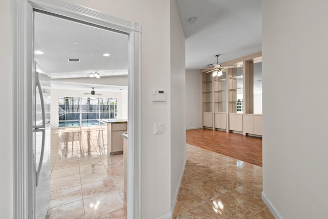 hallway featuring a textured ceiling