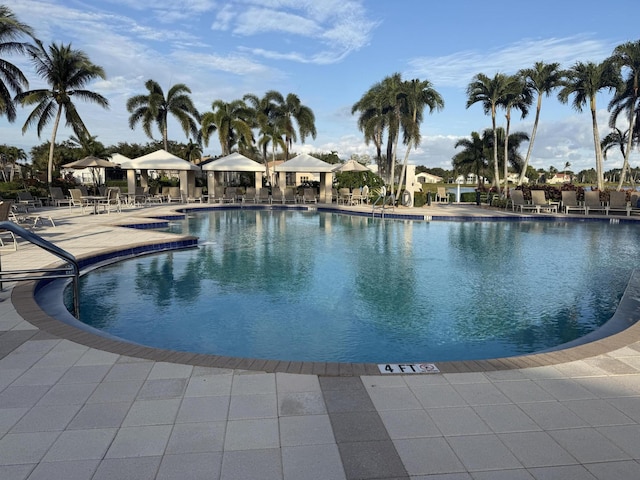 view of swimming pool featuring a patio area and a gazebo