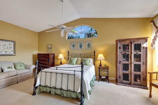 carpeted bedroom with vaulted ceiling and ceiling fan